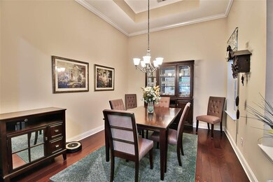 Features crown molding and tray ceiling