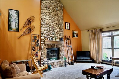 The Beautiful Floor to Ceiling Stone Fireplace giv