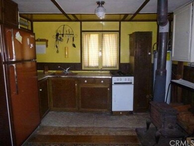 Furnishings included! Wood-burning stove!