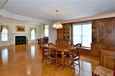 The dining room has built-ins and tray ceiling and