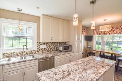 The bay window creates a sunny breakfast nook.