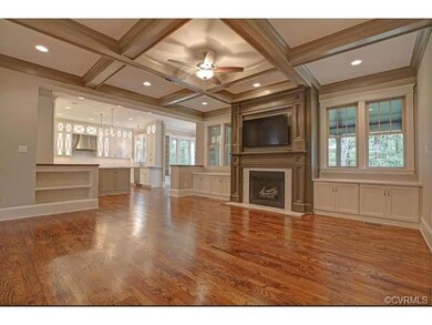 The Family Room features hardwood floors, wood cof