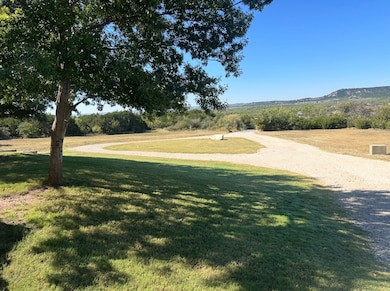 View of property's community with a yard