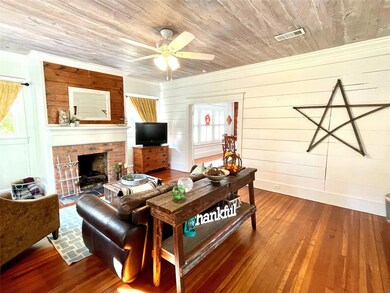 Exposed shiplap, original heart pine floors and ga