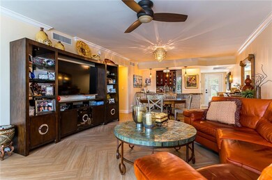 Living room to kitchen. Tile floors through out do