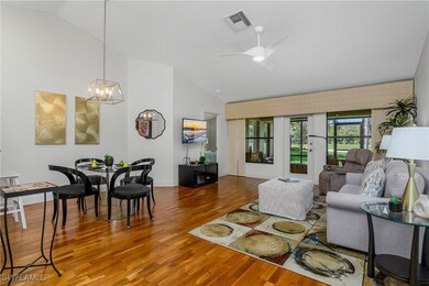 Living area with vaulted ceiling, wood finished fl