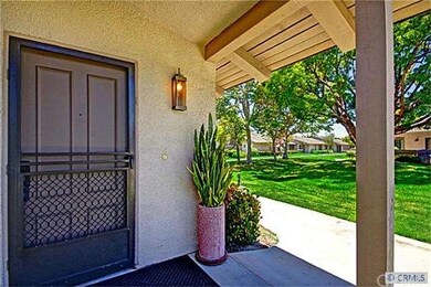 FRONT DOOR AREA.  GREENERY GREETS YOU AS YOU WALK 