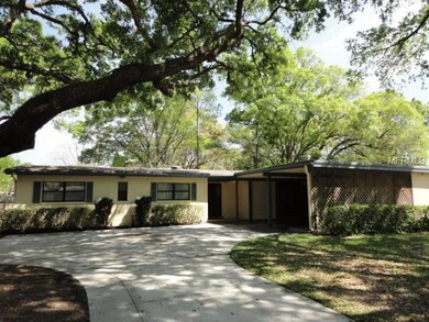 Oversized driveway and 2-car carport