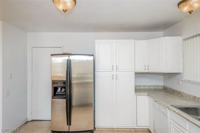 Kitchen has been remodeled and is open to the livi