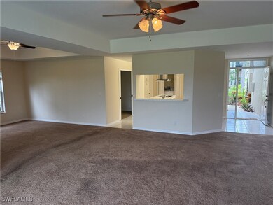 Unfurnished living room featuring a ceiling fan, l