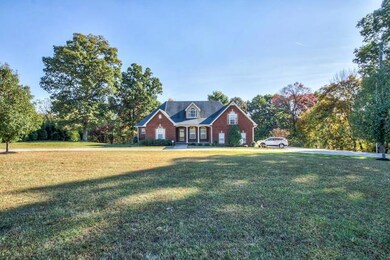 Front of the house features a large circular driveway.