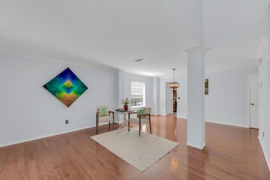 Sitting room featuring ornamental molding, wood f