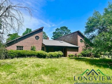 View of side of home featuring brick siding
