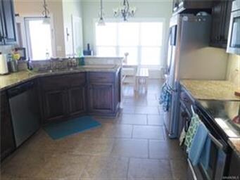 View of the kitchen and breakfast room from the di