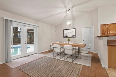 Dining area showing pool and deck. Virtually stage