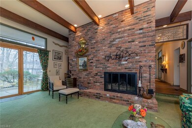 The exposed brick accent wall with fireplace is on