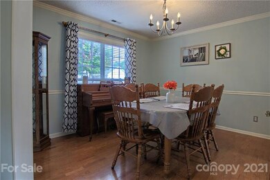 Formal Dining with crown molding &hardwood floors