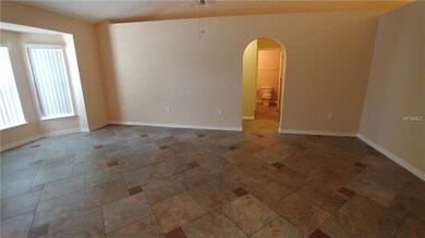 Living Room with bay window in front.