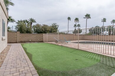 Putting green and removable pool fence