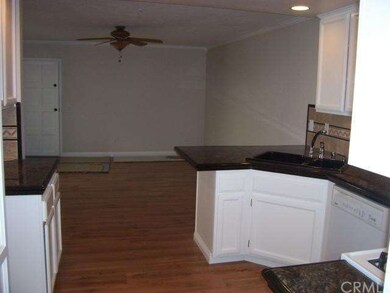 Lovely kitchen opens to family room with new wood 