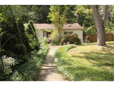 Welcoming walkway to rear entrance off driveway.