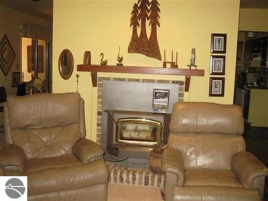 Fireplace facing the living area and window left n