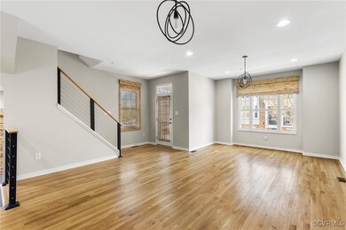 Unfurnished living room with recessed lighting, ba