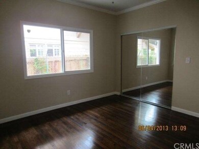 Bedroom with mirror closet doors. 
