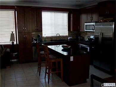 Kitchen opening up to Family Room for casual gathe
