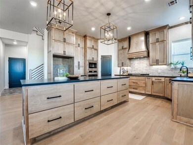 Kitchen featuring a chandelier, light hardwood / w