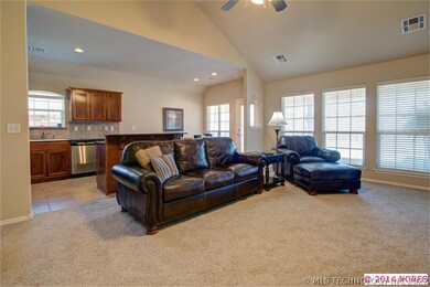 Living area with window wall and vaulted ceiling o