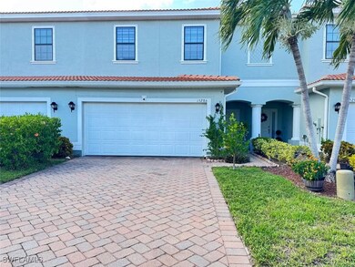 Mediterranean / spanish house featuring stucco siding, decorative driveway, and a tiled roof