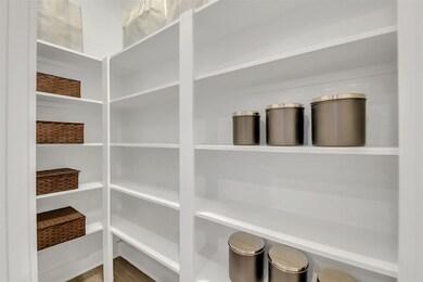 Spacious pantry connected to the kitchen.