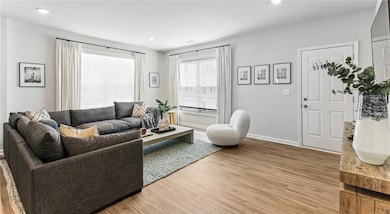 Living room with light wood-type flooring