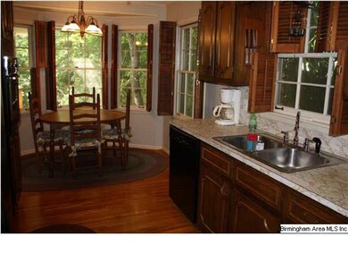 Great kitchen with hardwood floors and lots of lig