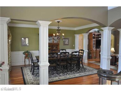 Dining Room. Stately columns define this gracious formal dining room to the left of the foyer as you enter this fine home.