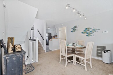 View of carpeted dining area