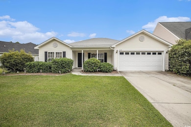 Single story home with a porch, driveway, roof with shingles, a front lawn, and an attached garage