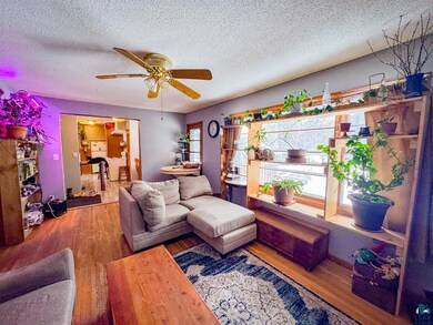 Living room with plenty of natural light, a textur