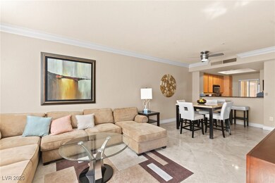 Living room featuring crown molding, visible vents