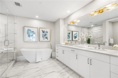 Bathroom featuring vanity and separate shower and 
