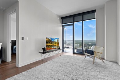 Living room with expansive windows, baseboards, a