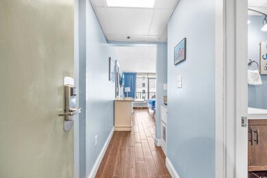 Hallway featuring wood-type flooring
