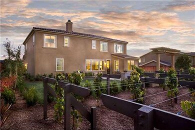 Back yard with patio, lawn area, trellis, and 