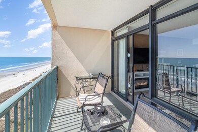 Balcony with a view of the beach and a water view