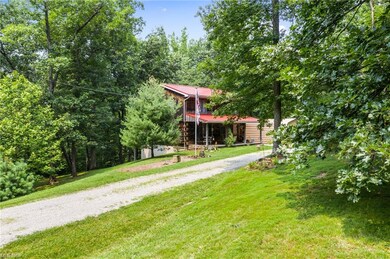 Home sits back off the road for wooded privacy