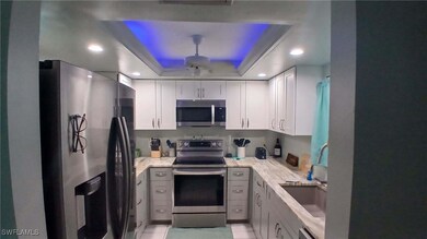 Kitchen featuring stainless steel appliances, whit