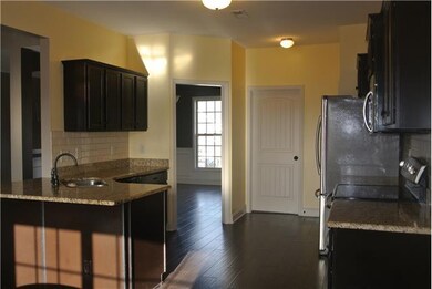 EAT-IN KITCHEN W/ ALL APPLIANCES & BREAKFAST BAR
