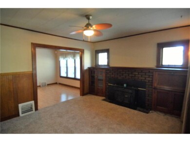 Great Room with original wood work, fireplace and 