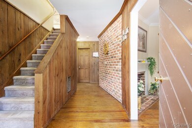 Wow! Rustic brick wall in foyer, random width wide